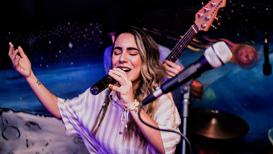 A woman singing at a karaoke